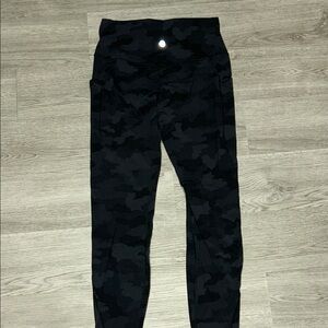 lululemon athletica Women’s Dark Camouflage Leggings. Wear imperfection shown.